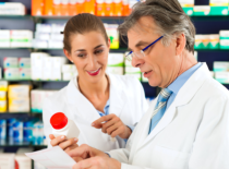 two pharmacist discussing in a medicine